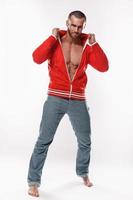 Handsome and muscular man in red jacket photo