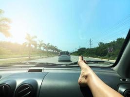 Highway with palm trees and blue sky photo