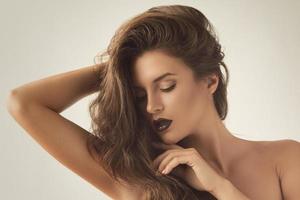 Portrait of beautiful woman with luxurious hair photo