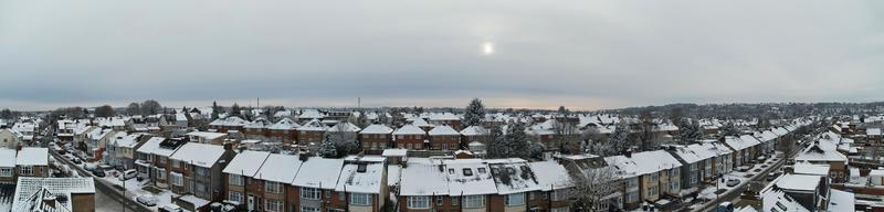 High angle view of Snow covered North Luton's landscape and Cityscape, Aerial Footage of Northern Luton City of England UK after Snow Fall. The 1st Snow Fall of this Winter of 2022 photo