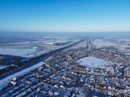 High angle view of Snow covered North Luton's landscape and Cityscape, Aerial Footage of Northern Luton City of England UK after Snow Fall. The 1st Snow Fall of this Winter of 2022 photo