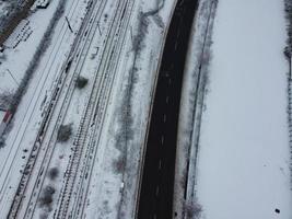 High angle view of Snow covered North Luton's landscape and Cityscape, Aerial Footage of Northern Luton City of England UK after Snow Fall. The 1st Snow Fall of this Winter of 2022 photo