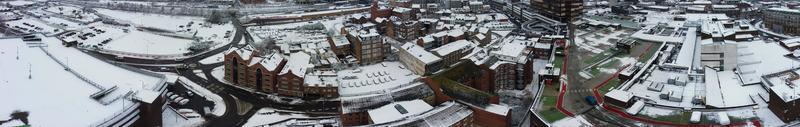 High angle view of Snow covered North Luton's landscape and Cityscape, Aerial Footage of Northern Luton City of England UK after Snow Fall. The 1st Snow Fall of this Winter of 2022 photo