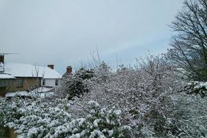 High angle view of Snow covered North Luton's landscape and Cityscape, Aerial Footage of Northern Luton City of England UK after Snow Fall. The 1st Snow Fall of this Winter of 2022 photo