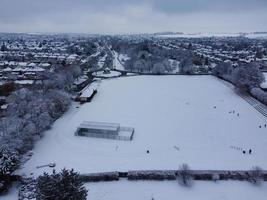 High angle view of Snow covered North Luton's landscape and Cityscape, Aerial Footage of Northern Luton City of England UK after Snow Fall. The 1st Snow Fall of this Winter of 2022 photo