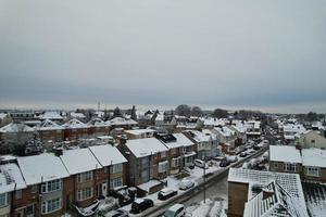 High angle view of Snow covered North Luton's landscape and Cityscape, Aerial Footage of Northern Luton City of England UK after Snow Fall. The 1st Snow Fall of this Winter of 2022 photo