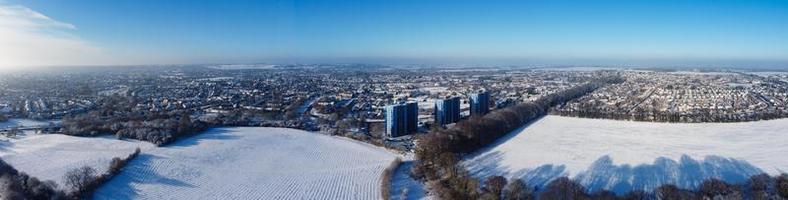 High angle view of Snow covered North Luton's landscape and Cityscape, Aerial Footage of Northern Luton City of England UK after Snow Fall. The 1st Snow Fall of this Winter of 2022 photo