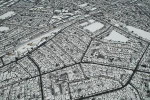 High angle view of Snow covered North Luton's landscape and Cityscape, Aerial Footage of Northern Luton City of England UK after Snow Fall. The 1st Snow Fall of this Winter of 2022 photo