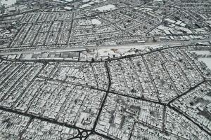 High angle view of Snow covered North Luton's landscape and Cityscape, Aerial Footage of Northern Luton City of England UK after Snow Fall. The 1st Snow Fall of this Winter of 2022 photo