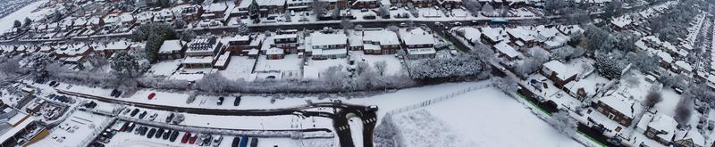 High angle view of Snow covered North Luton's landscape and Cityscape, Aerial Footage of Northern Luton City of England UK after Snow Fall. The 1st Snow Fall of this Winter of 2022 photo