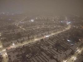 High angle view of Snow covered North Luton's landscape and Cityscape, Aerial Footage of Northern Luton City of England UK after Snow Fall. The 1st Snow Fall of this Winter of 2022 photo