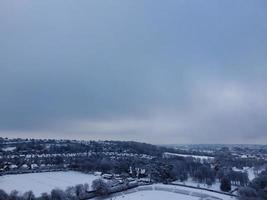 High angle view of Snow covered North Luton's landscape and Cityscape, Aerial Footage of Northern Luton City of England UK after Snow Fall. The 1st Snow Fall of this Winter of 2022 photo