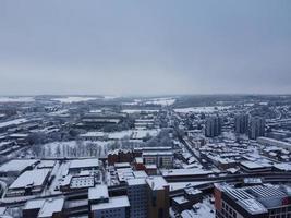 High angle view of Snow covered North Luton's landscape and Cityscape, Aerial Footage of Northern Luton City of England UK after Snow Fall. The 1st Snow Fall of this Winter of 2022 photo