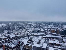 High angle view of Snow covered North Luton's landscape and Cityscape, Aerial Footage of Northern Luton City of England UK after Snow Fall. The 1st Snow Fall of this Winter of 2022 photo