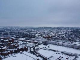 High angle view of Snow covered North Luton's landscape and Cityscape, Aerial Footage of Northern Luton City of England UK after Snow Fall. The 1st Snow Fall of this Winter of 2022 photo