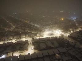 High angle view of Snow covered North Luton's landscape and Cityscape, Aerial Footage of Northern Luton City of England UK after Snow Fall. The 1st Snow Fall of this Winter of 2022 photo