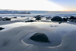 Vikten Beach in the Lofoten Islands, Norway in the winter at sunset. photo