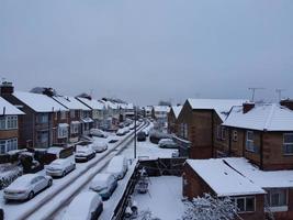 High angle view of Snow covered North Luton's landscape and Cityscape, Aerial Footage of Northern Luton City of England UK after Snow Fall. The 1st Snow Fall of this Winter of 2022 photo