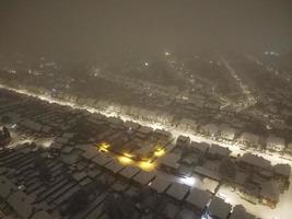 High angle view of Snow covered North Luton's landscape and Cityscape, Aerial Footage of Northern Luton City of England UK after Snow Fall. The 1st Snow Fall of this Winter of 2022 photo