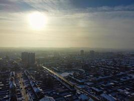 High angle view of Snow covered North Luton's landscape and Cityscape, Aerial Footage of Northern Luton City of England UK after Snow Fall. The 1st Snow Fall of this Winter of 2022 photo