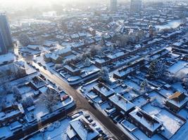 High angle view of Snow covered North Luton's landscape and Cityscape, Aerial Footage of Northern Luton City of England UK after Snow Fall. The 1st Snow Fall of this Winter of 2022 photo