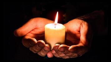 Hand holding candle video
