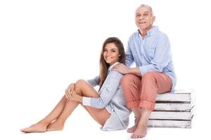 Woman and her eldery father on white background photo