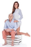 Woman and her eldery father on white background photo