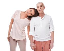 Woman and her eldelry father on white background photo