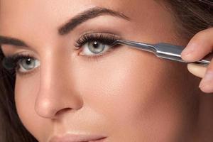 Woman with eyelash extension for maximum volume photo