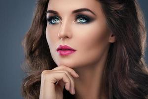 Gorgeous woman with beautiful makeup and hairdo photo