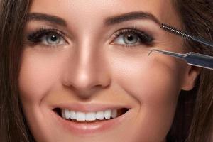 Woman with eyelash extension for maximum volume photo