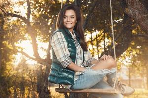 Woman in the park at sunny autumn day photo