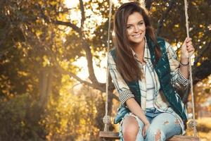 Woman in the park at sunny autumn day photo