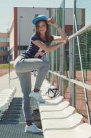 Beautiful teenage girl on the school yard photo