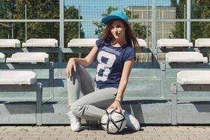 Beautiful teenage girl on the school yard photo