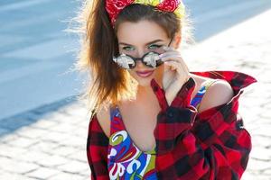 Beautiful and stylish girl on the street photo