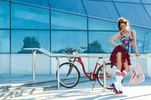 Girl on the roller-skate in the city photo