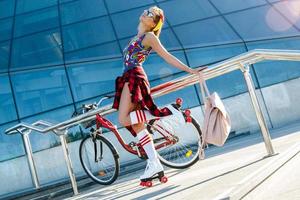 Girl on the roller-skate in the city photo