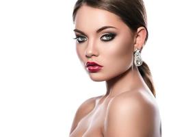 Portrait of young woman with beautiful earrings photo