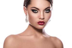 Portrait of young woman with beautiful earrings photo