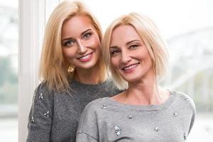 Mother and her adult daughter at home photo