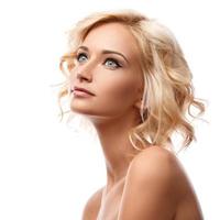 Young beautiful blonde girl on white background photo