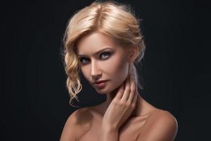 Blonde girl with pretty face on dark background photo