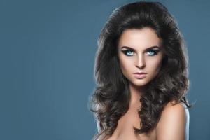 Stunning woman with beautiful makeup and hairdo photo