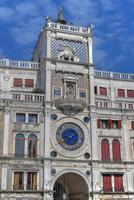 Saint Mark's Square in Venice Italy. It is the principal public square of Venice, Italy, where it is generally known just as la Piazza. photo