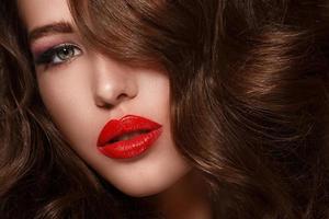 Portrait of beautiful woman with red lips photo