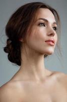 Beautiful woman with natural makeup and hairstyle photo