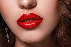 Close up of beautiful red female lips photo