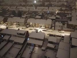 High angle view of Snow covered North Luton's landscape and Cityscape, Aerial Footage of Northern Luton City of England UK after Snow Fall. The 1st Snow Fall of this Winter of 2022 photo